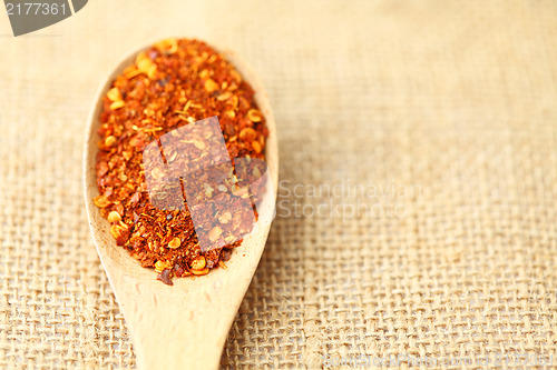 Image of Chili powder on wooden spoon