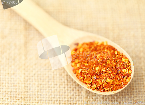 Image of Chili powder on wooden spoon