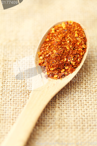 Image of Chili powder on wooden spoon