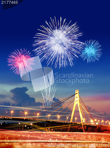 Image of firework over city at night