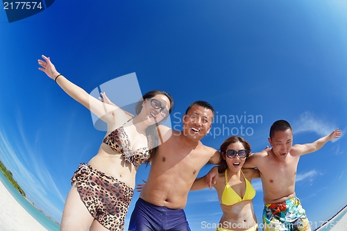 Image of group of happy young people have fun on bach