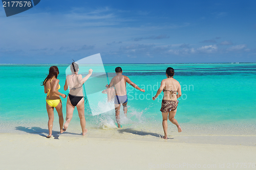 Image of group of happy young people have fun on bach