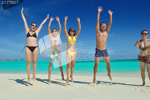 Image of group of happy young people have fun on bach