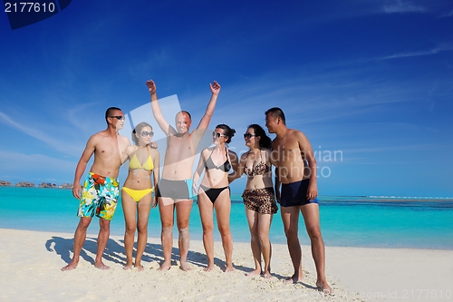 Image of group of happy young people have fun on bach