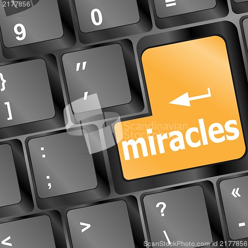 Image of Computer keyboard with miracles text