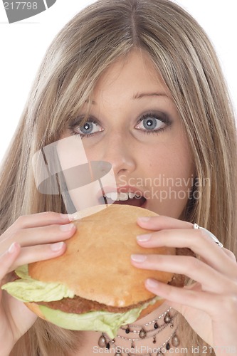 Image of Woman eating burger