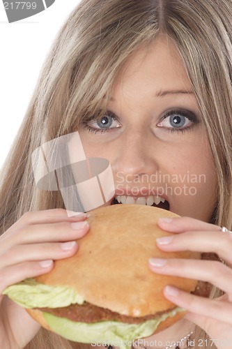 Image of Woman eating burger