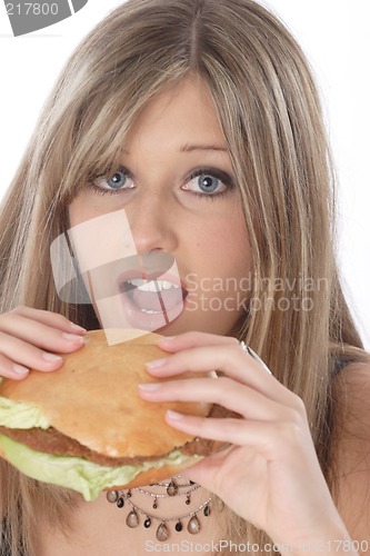 Image of Woman eating burger