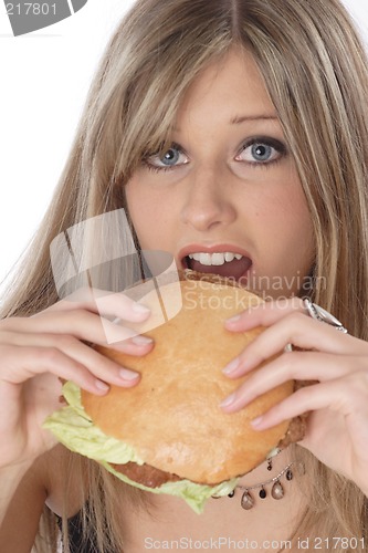 Image of Woman eating burger