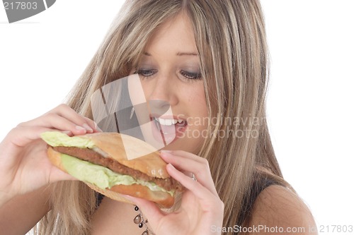 Image of Woman eating burger