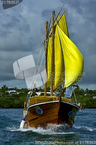 Image of  cloudy  pirate boat  and coastline in mauritius