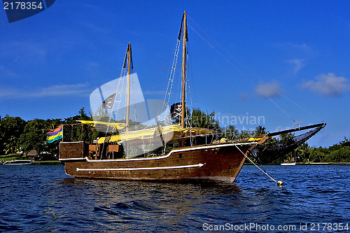 Image of pirate boat  and coastline in mauritius