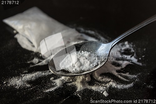 Image of Heroin being cooked in a spoon