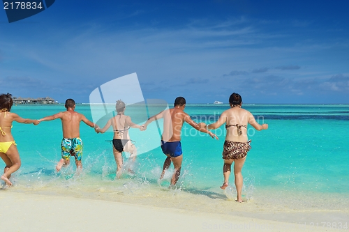 Image of group of happy young people have fun on bach