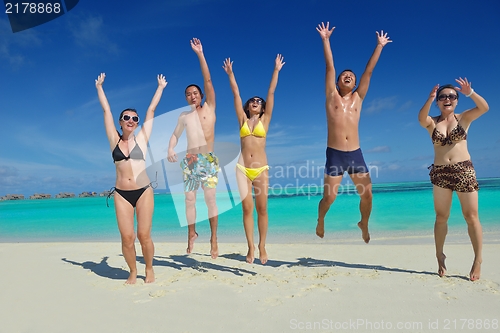 Image of group of happy young people have fun on bach