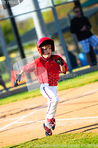 Image of Little league baseball player running