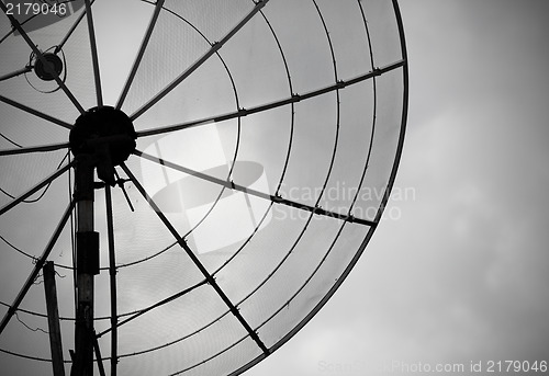 Image of Old parabolic antenna on sky background