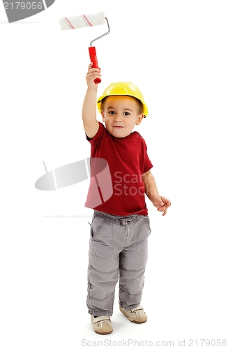 Image of Little boy painting with paint roller