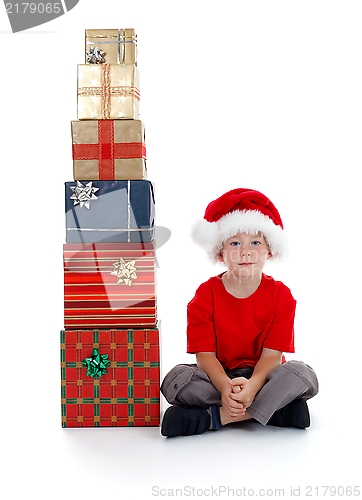 Image of Child sitting near presents