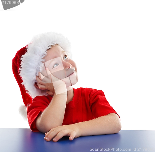 Image of Boy in Santa hat, looking to copy space