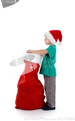 Image of Young boy holding santa-sack