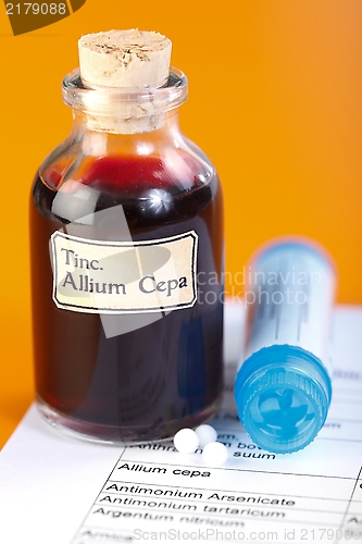 Image of Allium Cepa plant extract, homeopathic pills on sheet