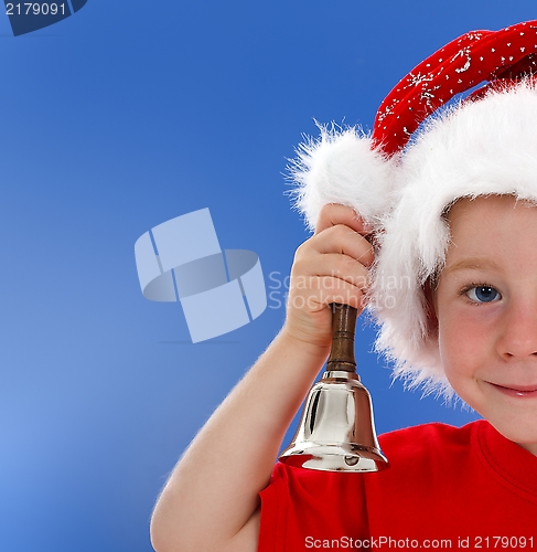 Image of Half face of bell ringing little boy on blue