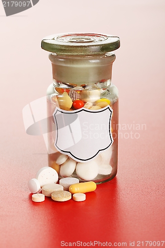 Image of Chemical bottle with colorful pills