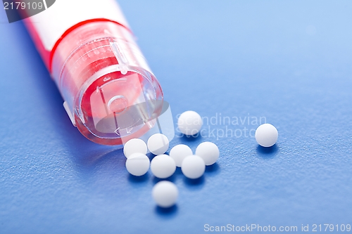 Image of Modern homeopathic pills and container