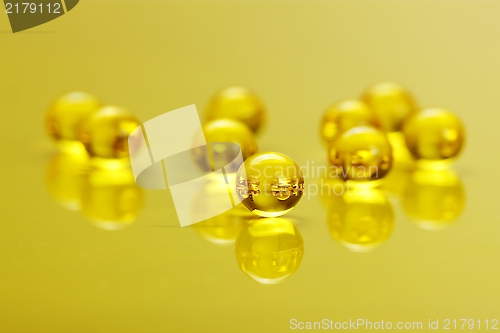 Image of Macro of E vitamine capsules on yellow