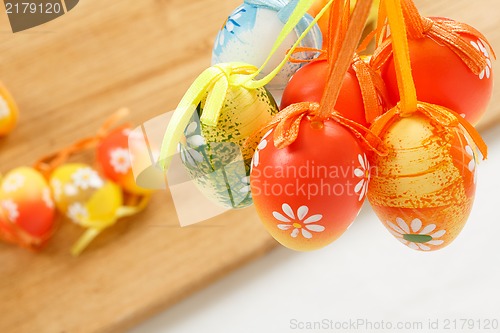 Image of hanged bright color easter eggs