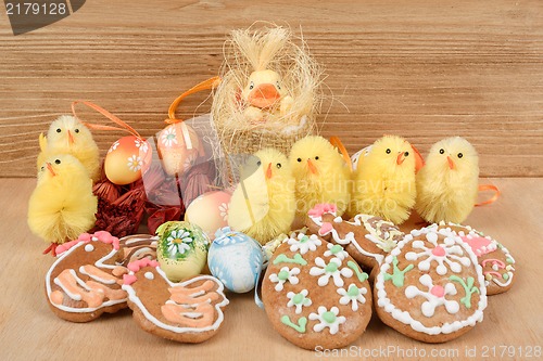 Image of easter decoration, ginger bread, chicken and painted eggs