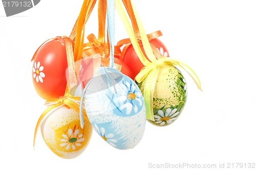 Image of hanged bright color easter eggs with bows