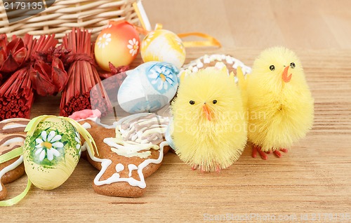 Image of easter decoration, ginger bread, chicken and painted eggs