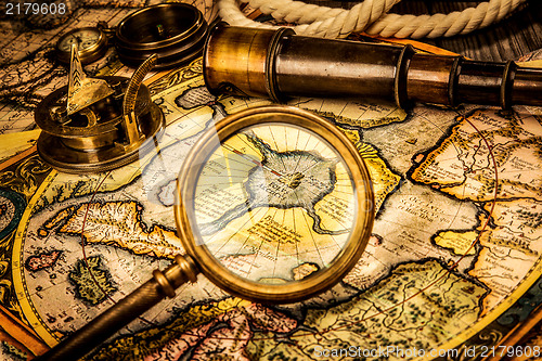 Image of Vintage magnifying glass lies on the ancient map of the North Po
