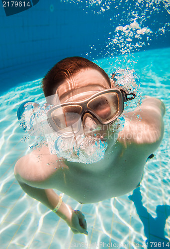 Image of teenager floats in pool