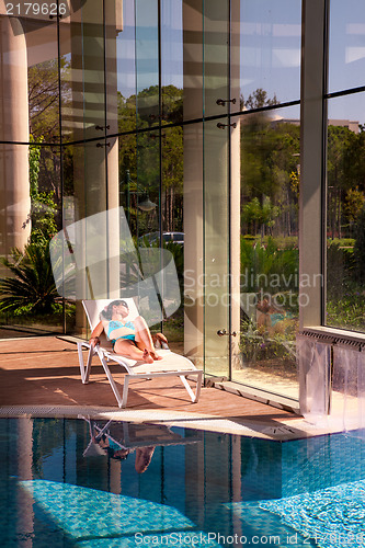 Image of girl on a sun lounger