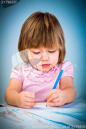 Image of Little baby girl draws pencil