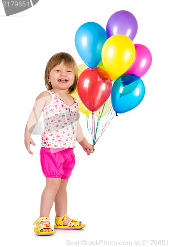 Image of Little girl smiling with balloons.