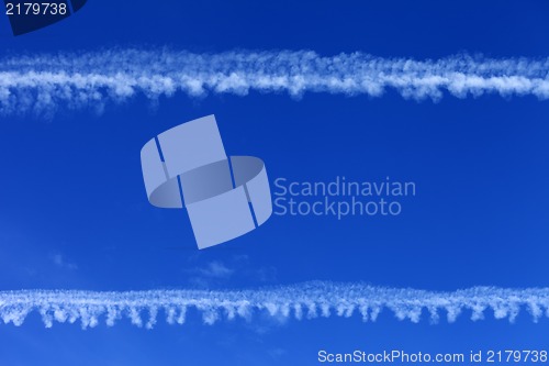 Image of Blue sky and condensation trails