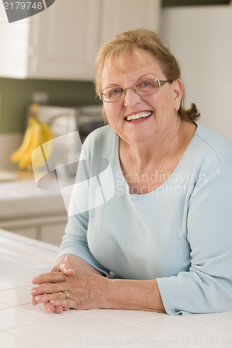 Image of Portrait of Beautiful Senior Adult Woman in Kitchen