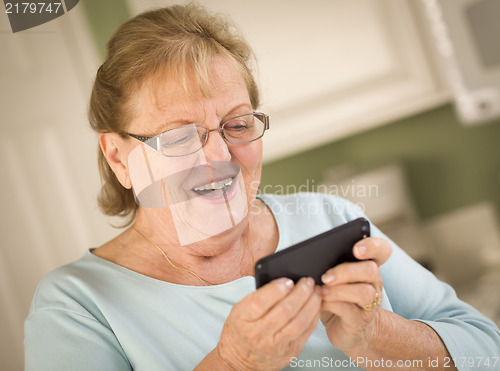 Image of Senior Adult Woman Texting on Smart Cell Phone