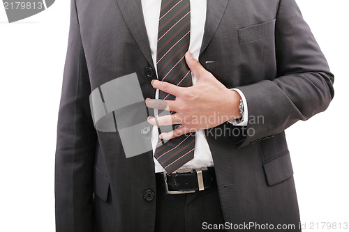 Image of Businessman holding his stomach in pain or indigestion 