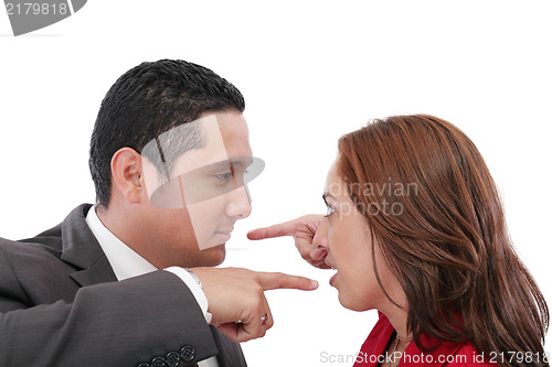 Image of Young couple pointing at each other against a white background 