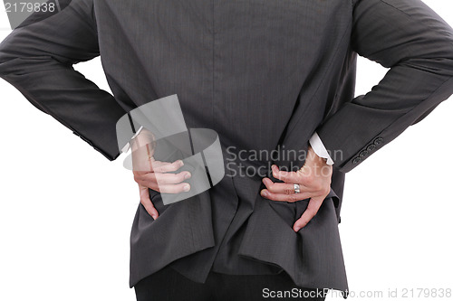 Image of Young businessman having some lower back pain 