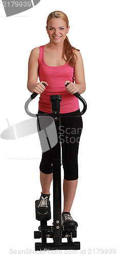 Image of Blonde Woman Exercising on a Stepper