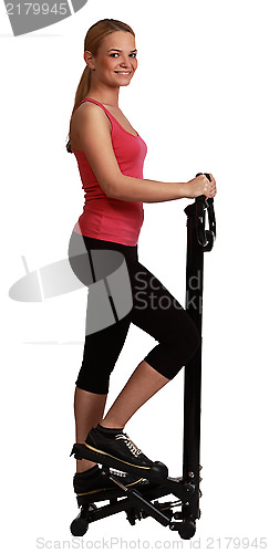 Image of Blonde Woman Exercising on a Stepper