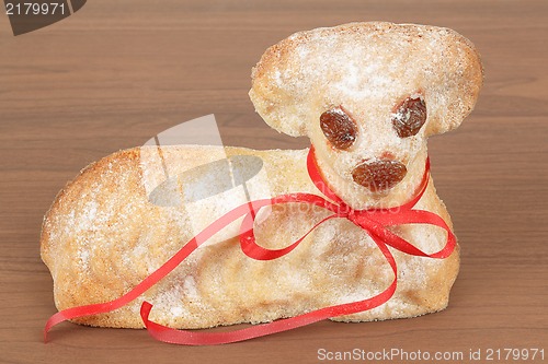 Image of Easter lamb with powdered sugar wooden background