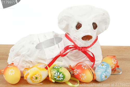 Image of white easter lamb with painted eggs