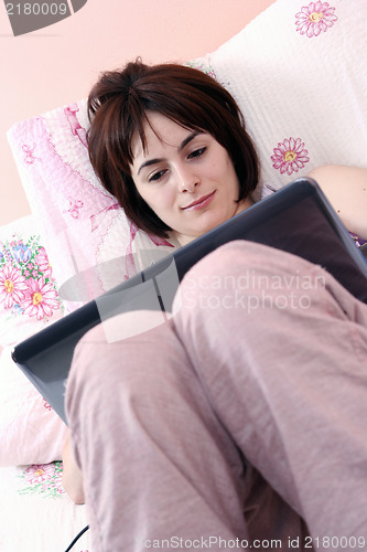 Image of Young woman with laptop 